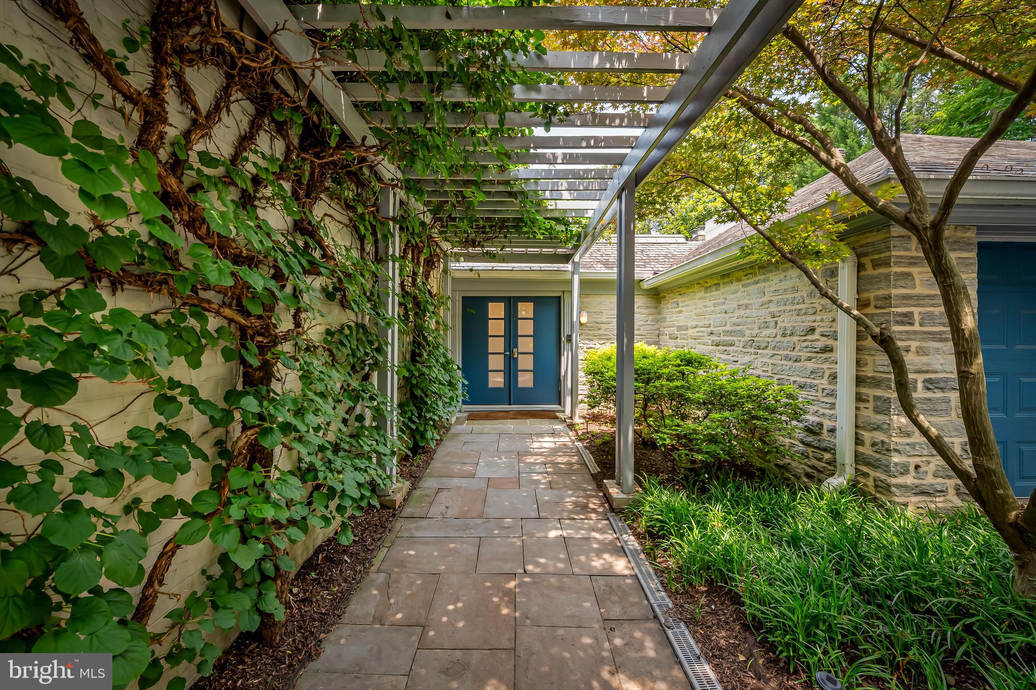 6 Meadow Road Baltimore, MD 21212 - Photo 3 of 66 a front view of a house with a yard and potted plants