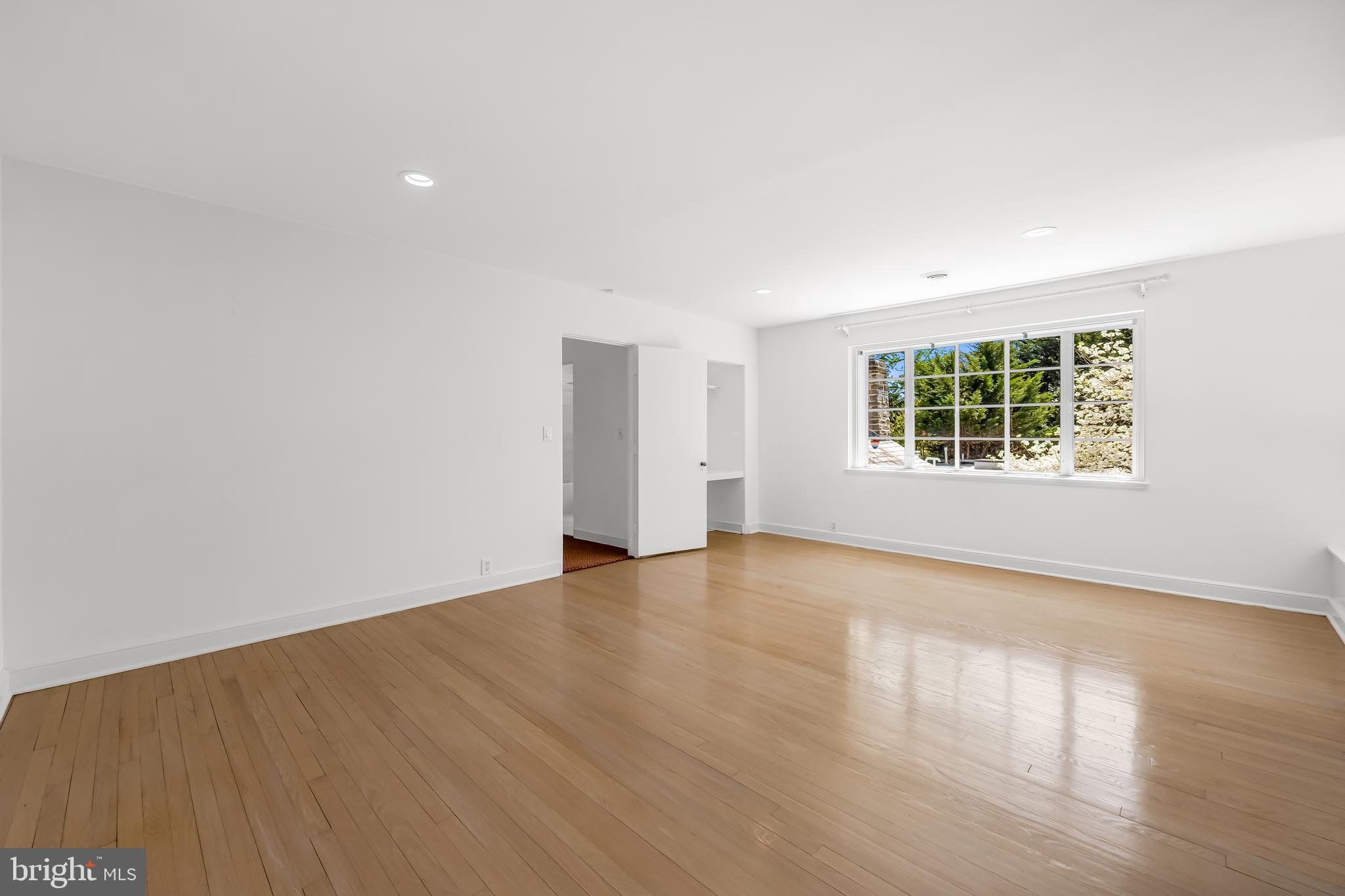 6 Meadow Road Baltimore, MD 21212 - Photo 48 of 66 an empty room with wooden floor and windows