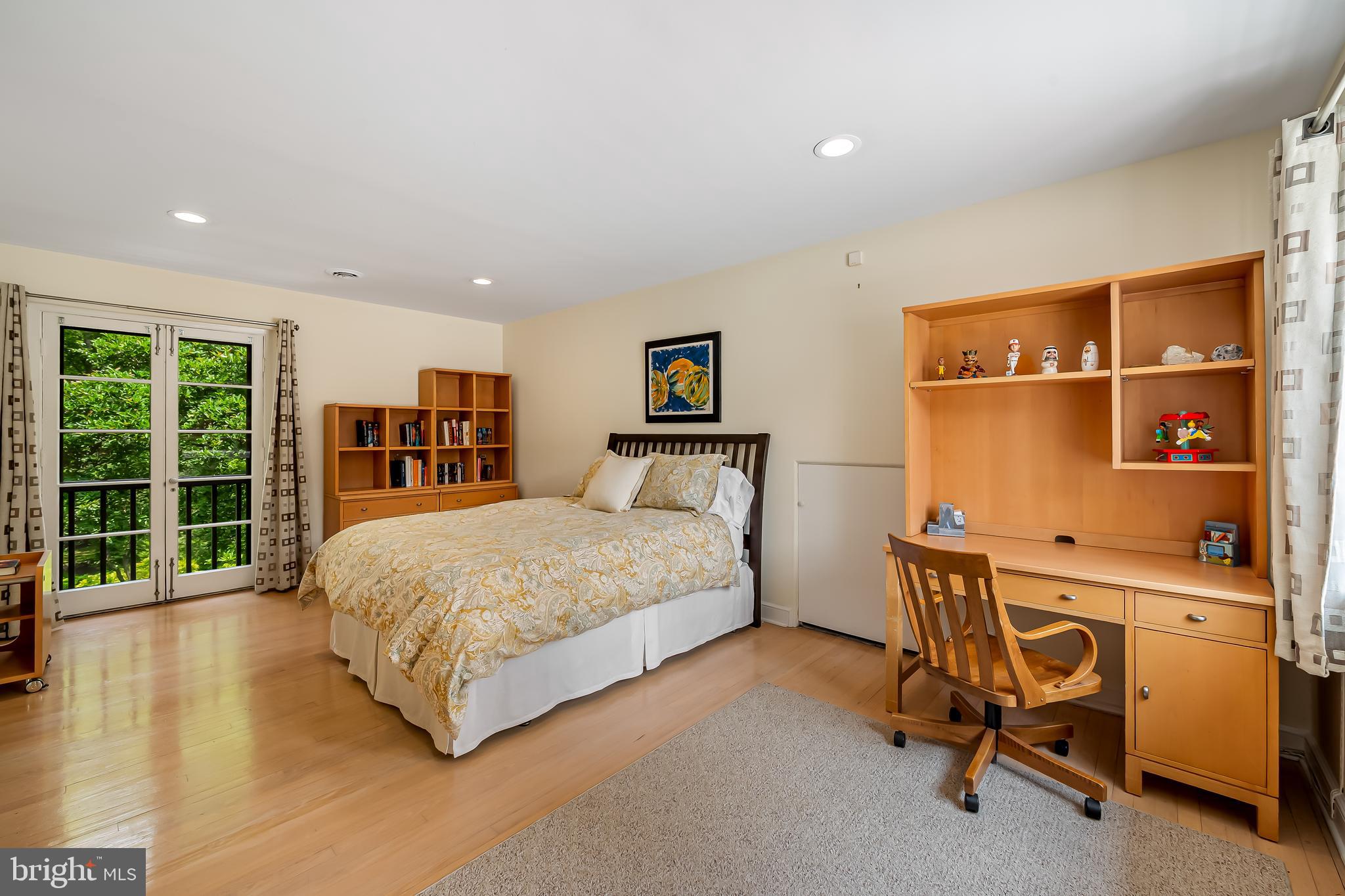6 Meadow Road Baltimore, MD 21212 - Photo 52 of 66 a spacious bedroom with a bed and a large window