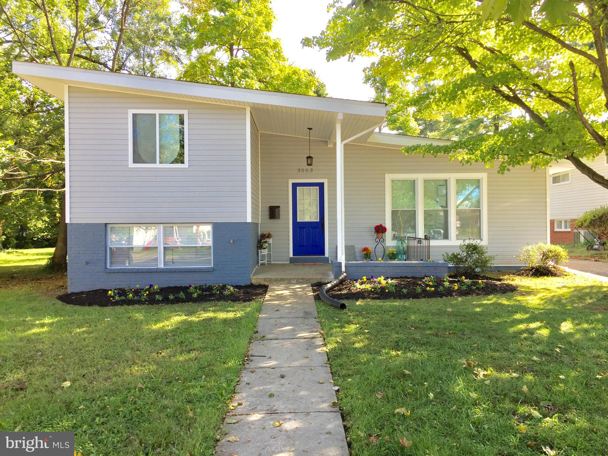 3503 Milford Mill Road Baltimore, MD 21244 - Photo 2 of 27 a front view of a house with a yard