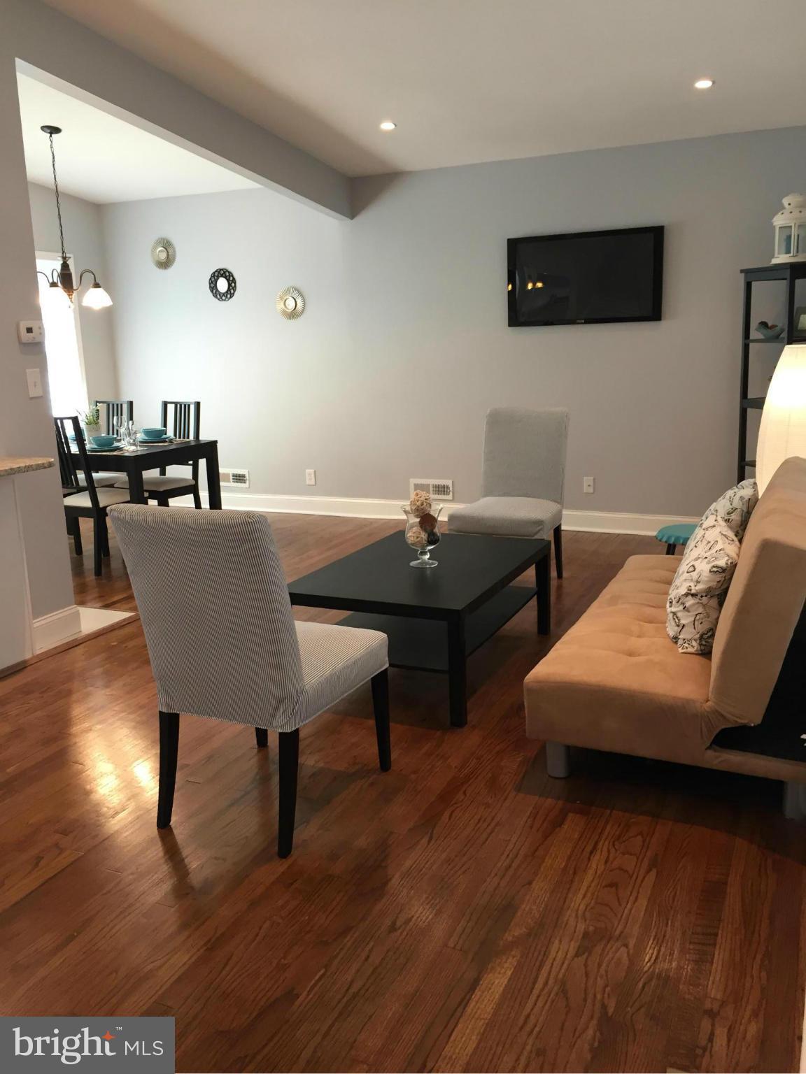 3503 Milford Mill Road Baltimore, MD 21244 - Photo 11 of 27 a view of a dining room with furniture and wooden floor