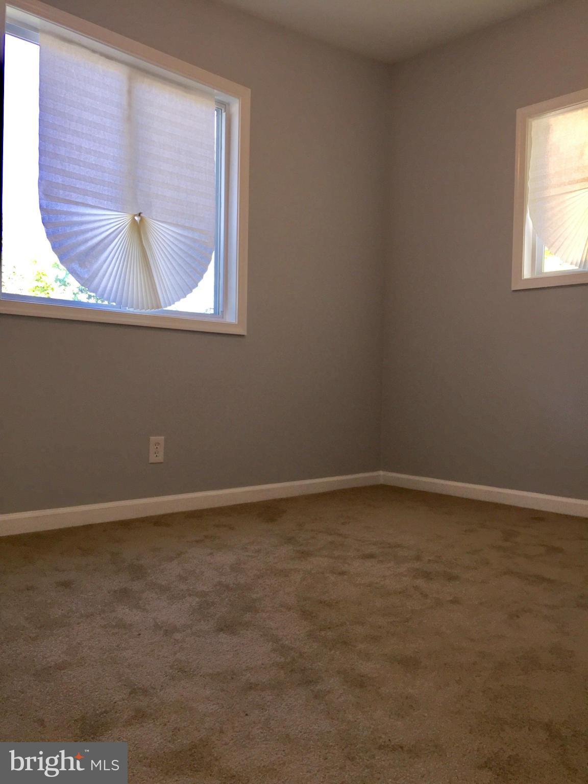 3503 Milford Mill Road Baltimore, MD 21244 - Photo 21 of 27 a view of an empty room with a window