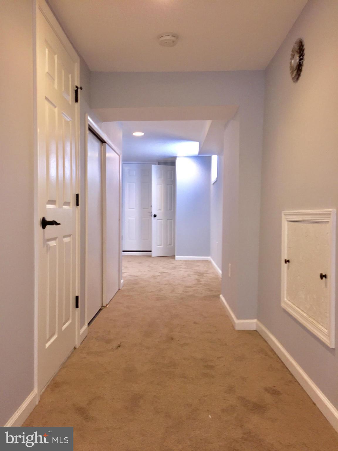 3503 Milford Mill Road Baltimore, MD 21244 - Photo 23 of 27 a view of a hallway with wooden shelves