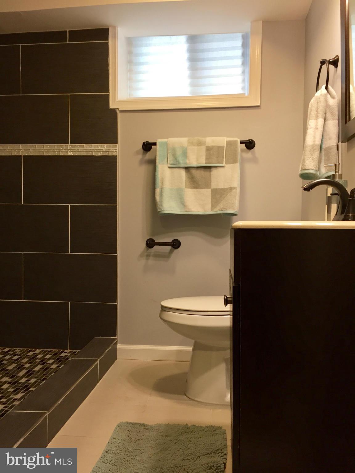 3503 Milford Mill Road Baltimore, MD 21244 - Photo 25 of 27 a bathroom with a toilet and a shower