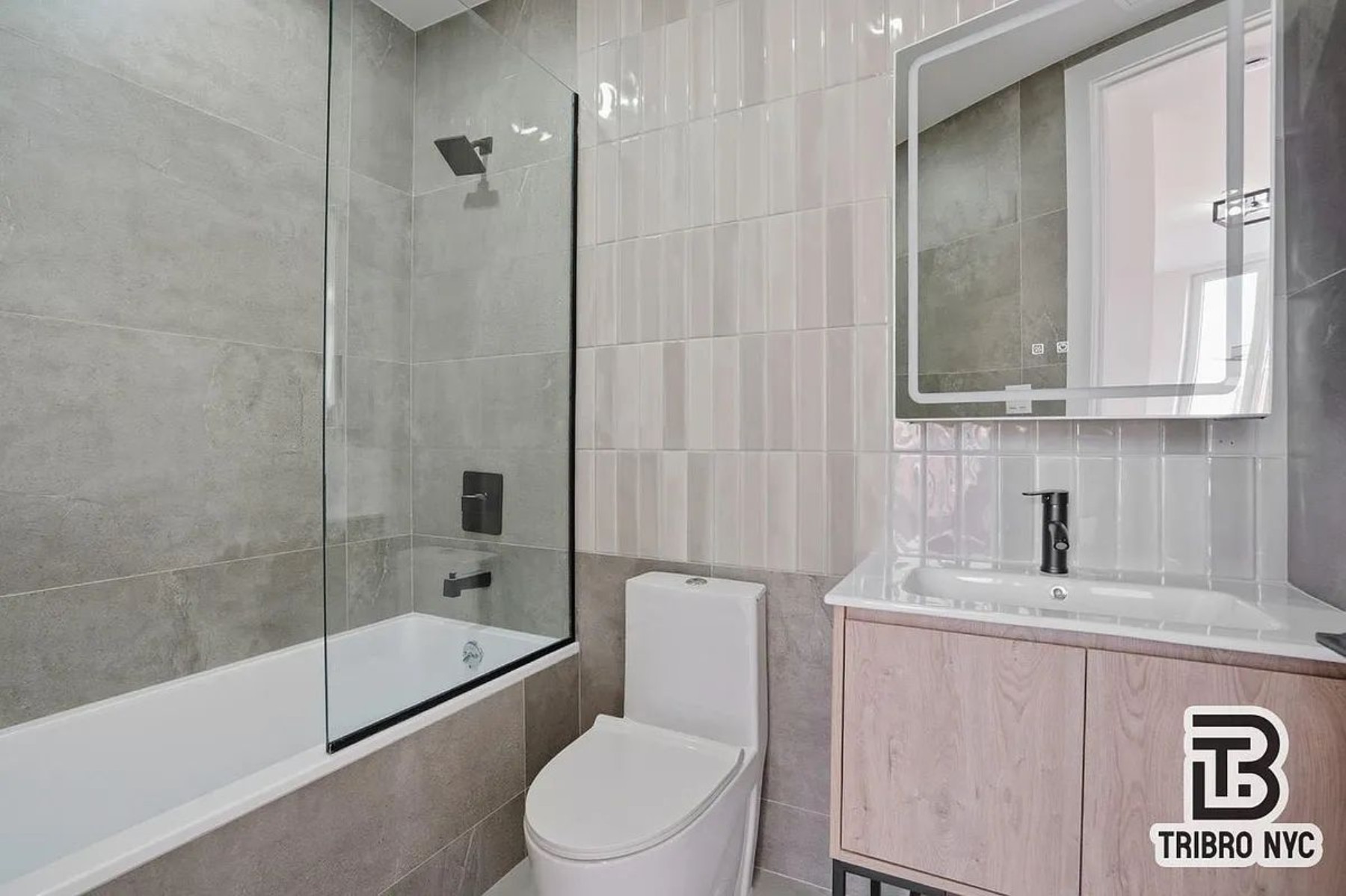 96 Moore Street, Unit 2X Brooklyn, NY 11206 - Photo 8 of 9 a bathroom with a sink a toilet and shower