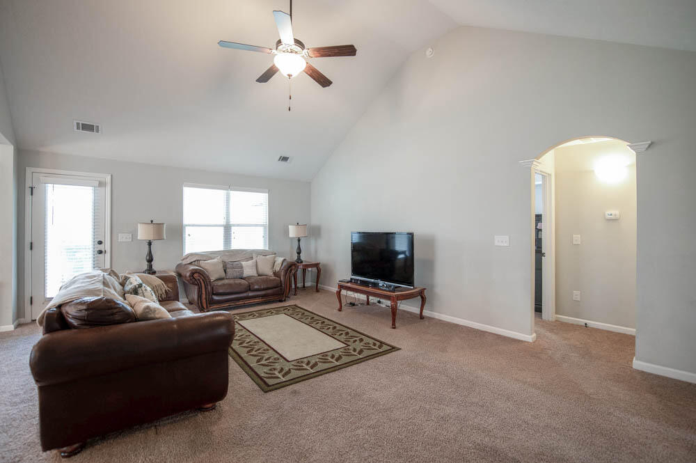 738 Neville Street Grovetown, GA 30813 - Photo 7 of 25 Living room with vaulted ceilings and fan!