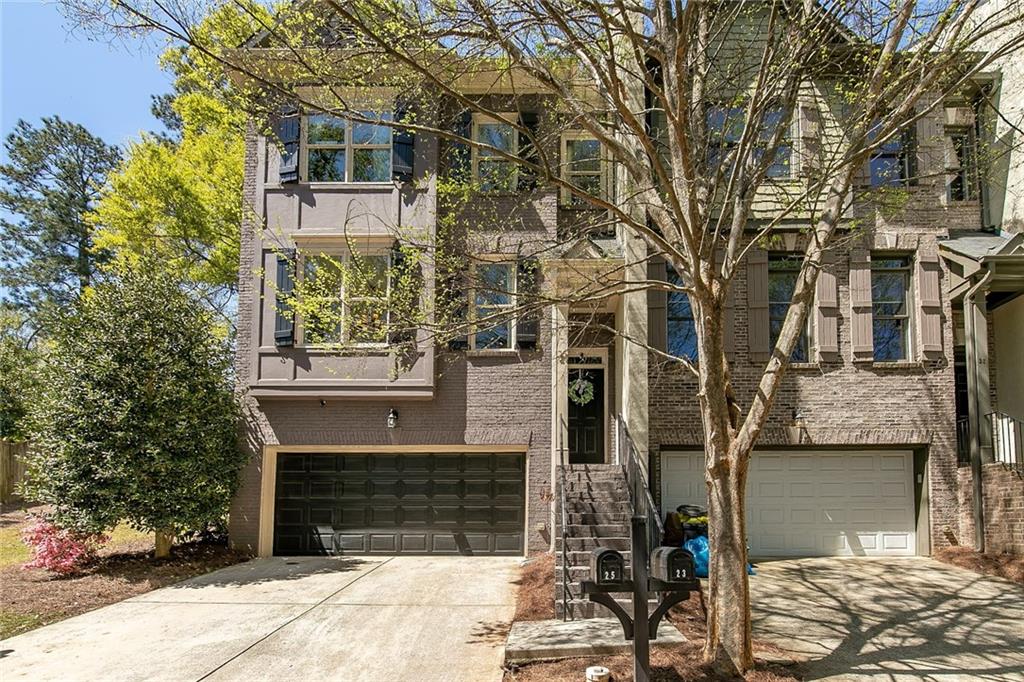 25 Oakhurst Common Drive Decatur, GA 30030 - Photo 1 of 1 a front view of a house with a yard