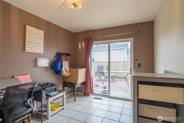 a view of a workspace with furniture and a workspace