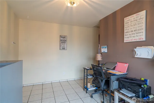 a bedroom with furniture and a flat screen tv