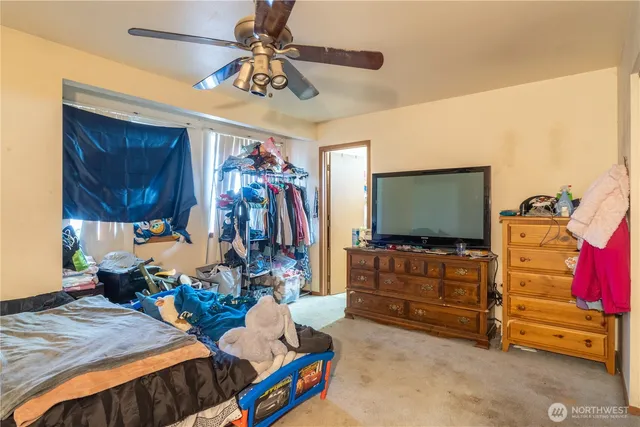 a bedroom with a bed and a closet