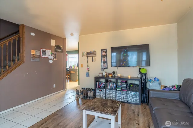 a room with a furniture and a potted plant
