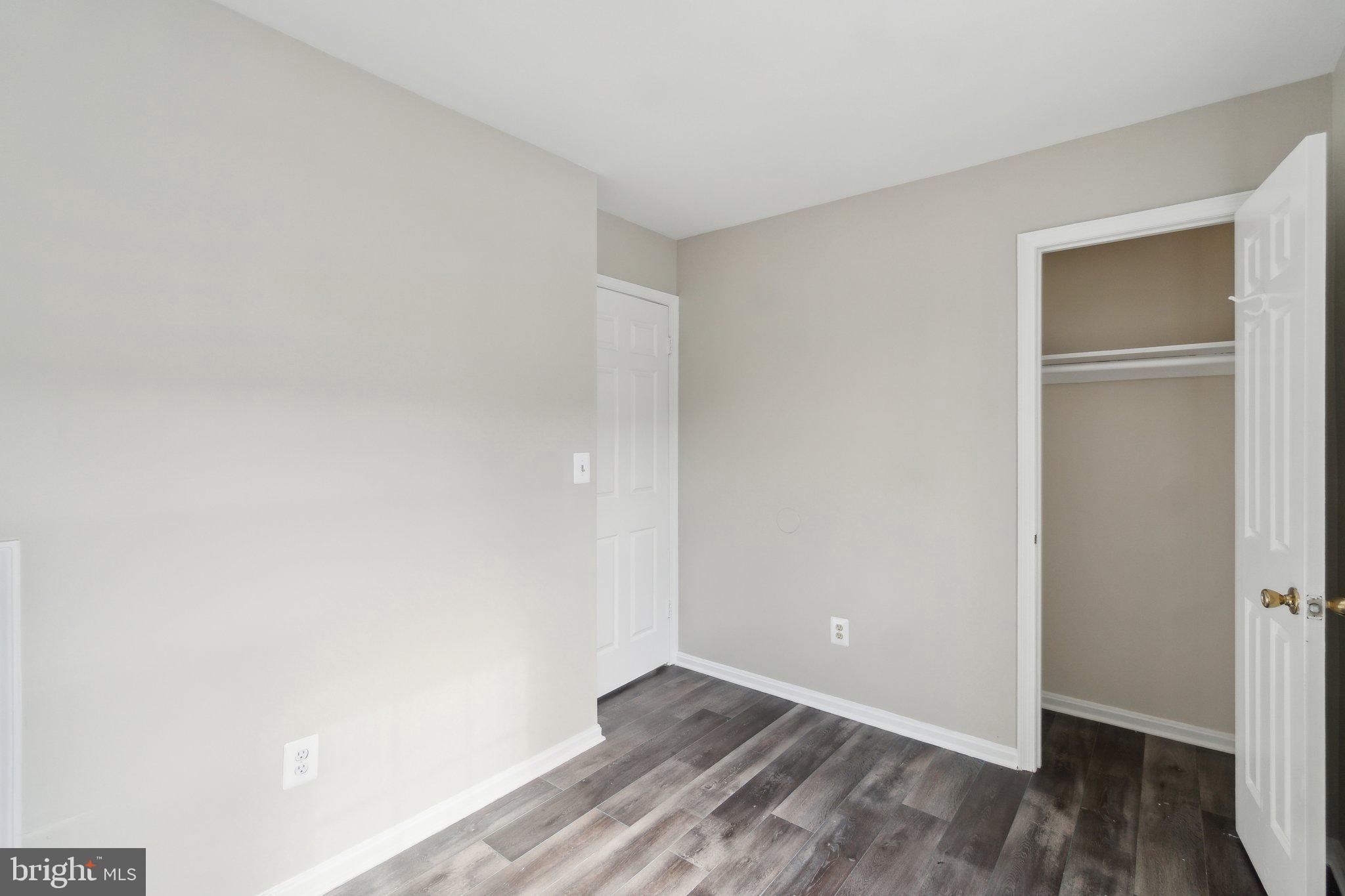 2016 37th Street Southeast, Unit 201 Washington, DC 20020 - Photo 13 of 17 a view of an empty room with wooden floor