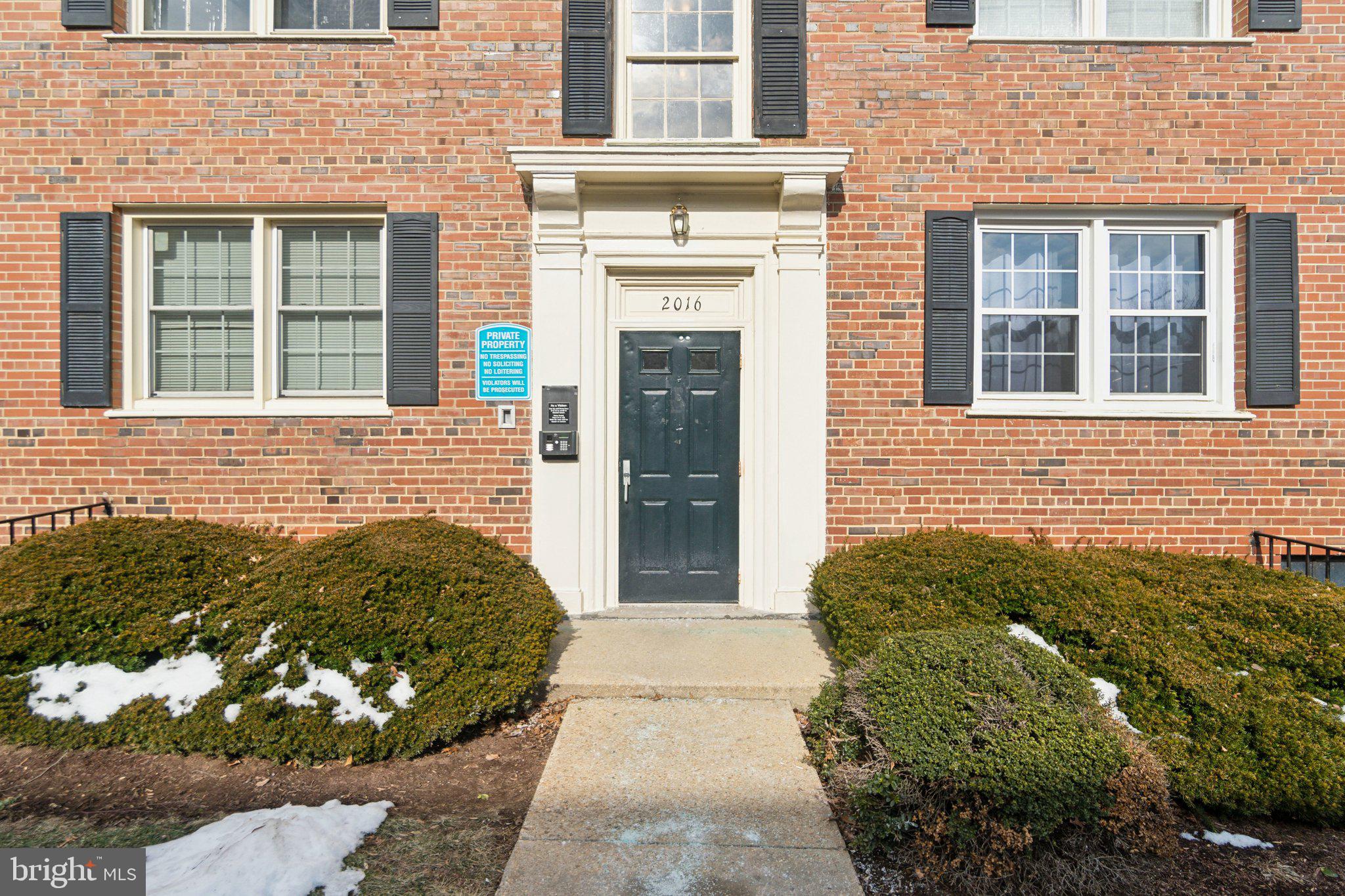 2016 37th Street Southeast, Unit 201 Washington, DC 20020 - Photo 2 of 17 front view of a brick house with a large windows
