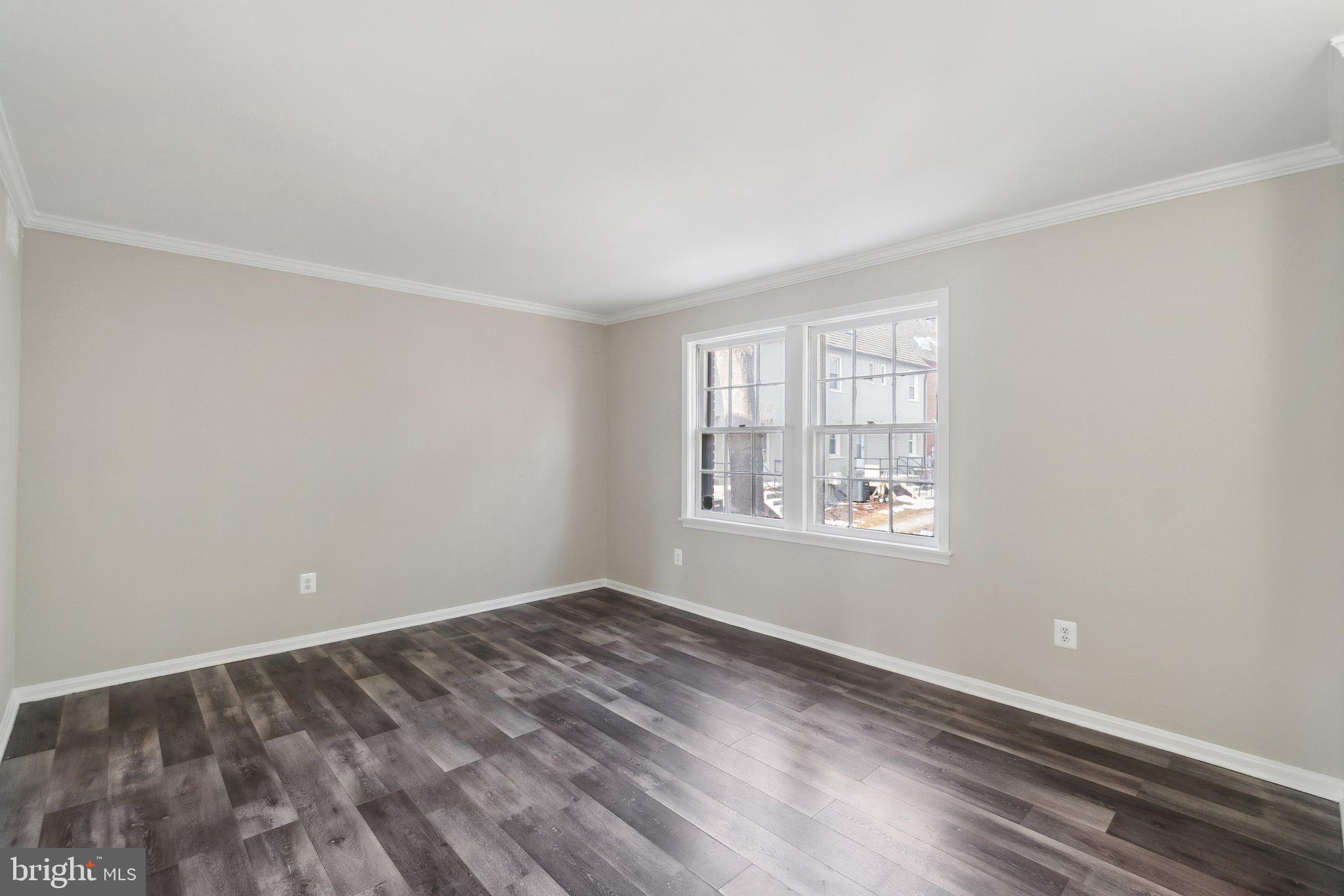 2016 37th Street Southeast, Unit 201 Washington, DC 20020 - Photo 9 of 17 wooden floor in an empty room with a window