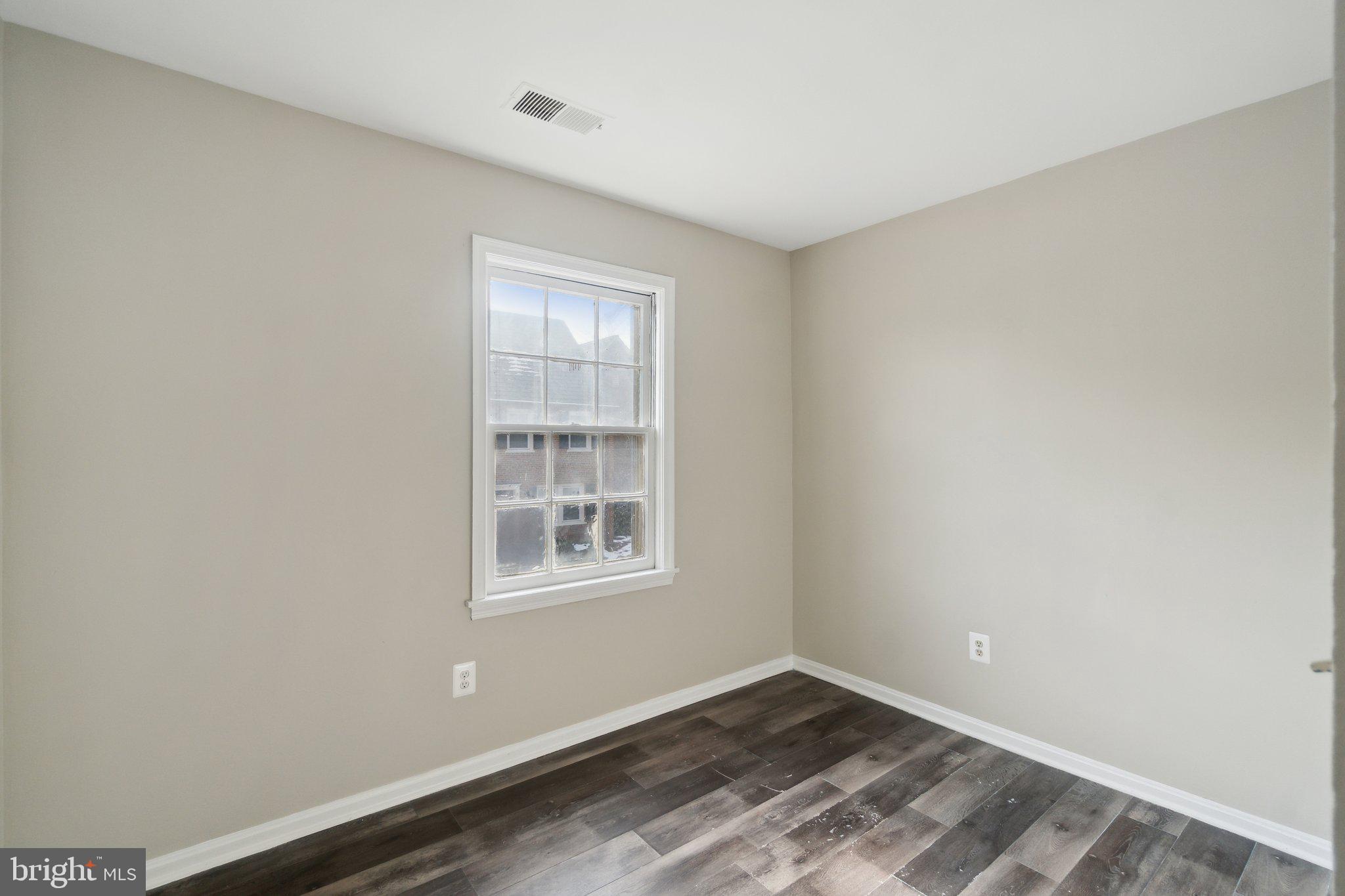 2016 37th Street Southeast, Unit 201 Washington, DC 20020 - Photo 10 of 17 an empty room with windows