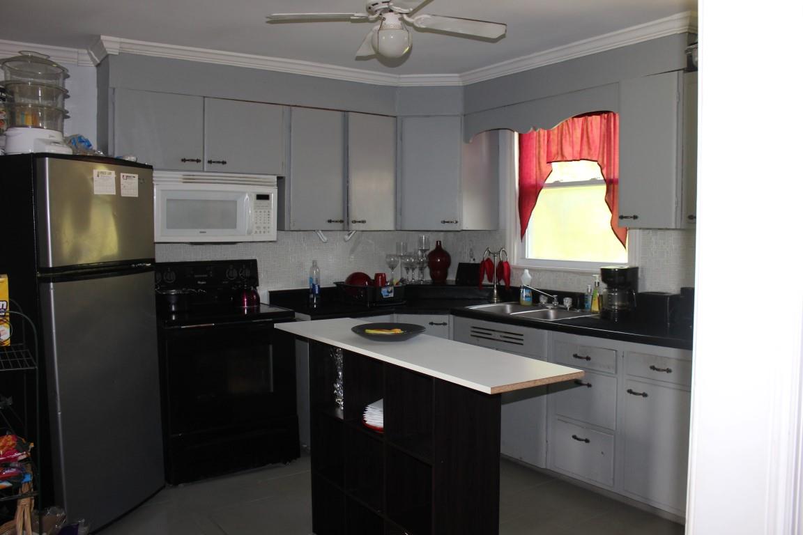 221 Randy Road Madison, TN 37115 - Photo 7 of 23 a kitchen with a sink stove and refrigerator