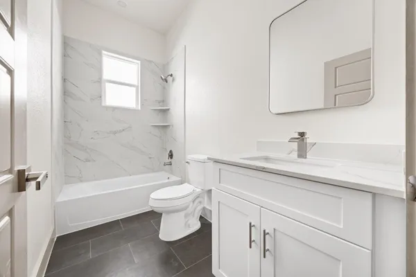 a bathroom with a sink a toilet and a bathtub