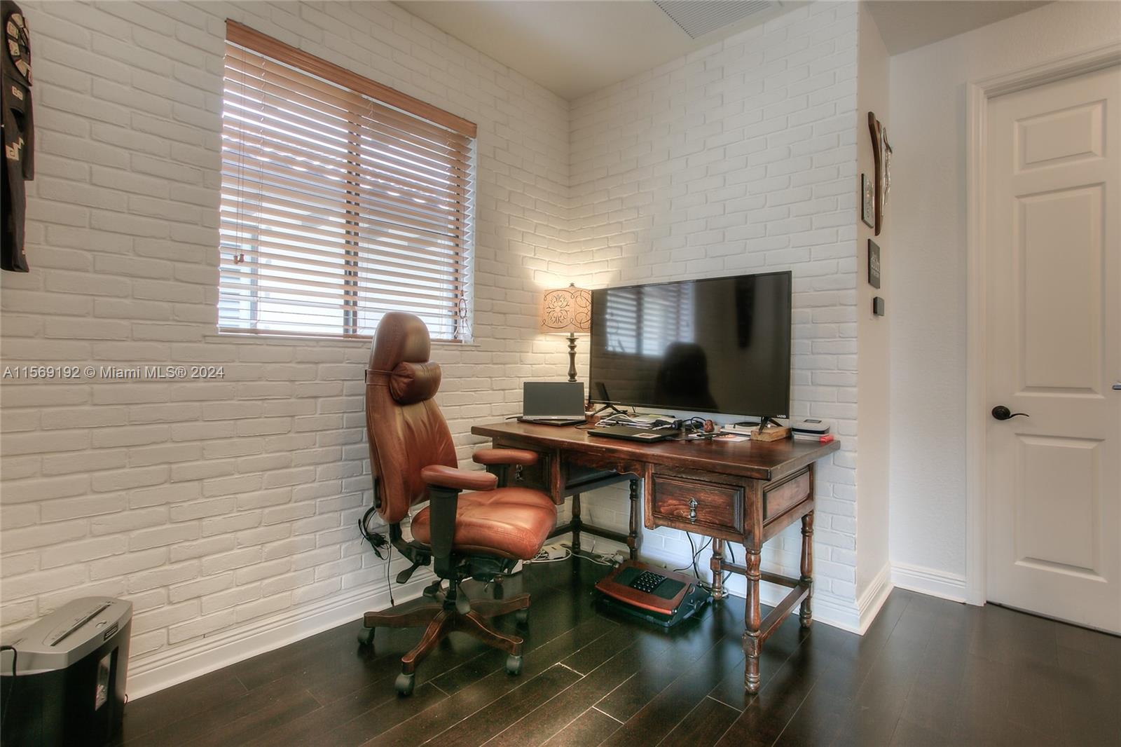 3053 Indiana Street, Unit 12 Miami, FL 33133 - Photo 14 of 23 a view of a workspace with furniture and a window