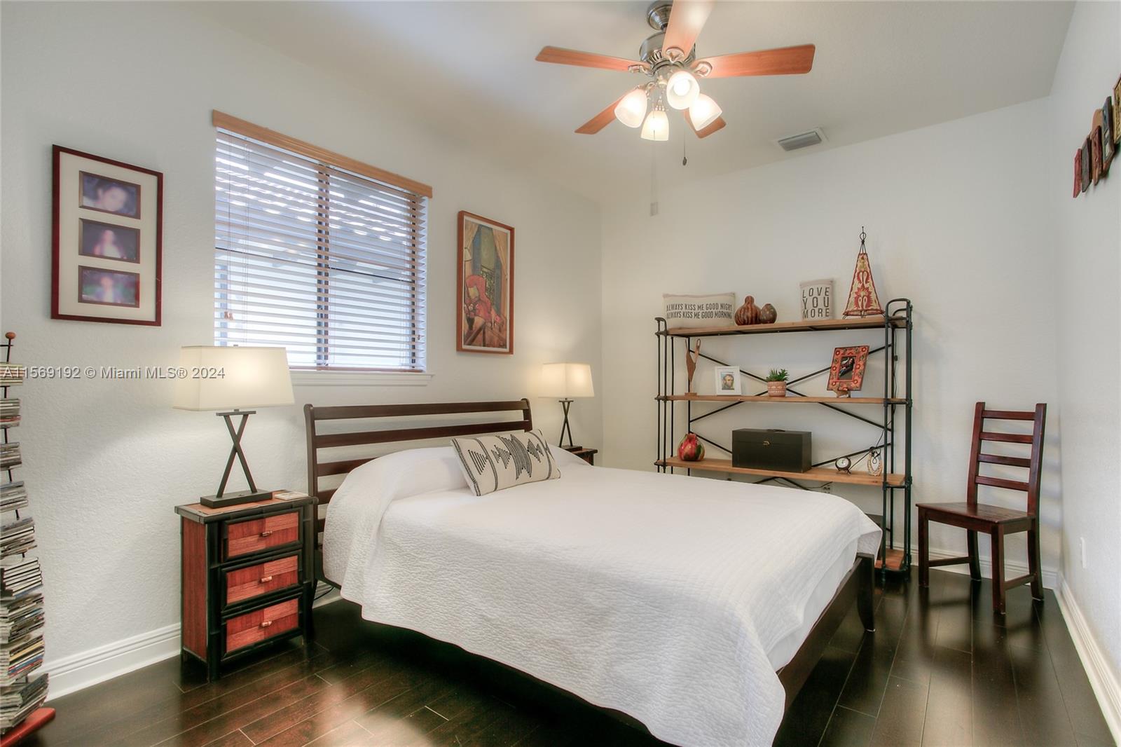 3053 Indiana Street, Unit 12 Miami, FL 33133 - Photo 15 of 23 a bedroom with a bed and a chandelier
