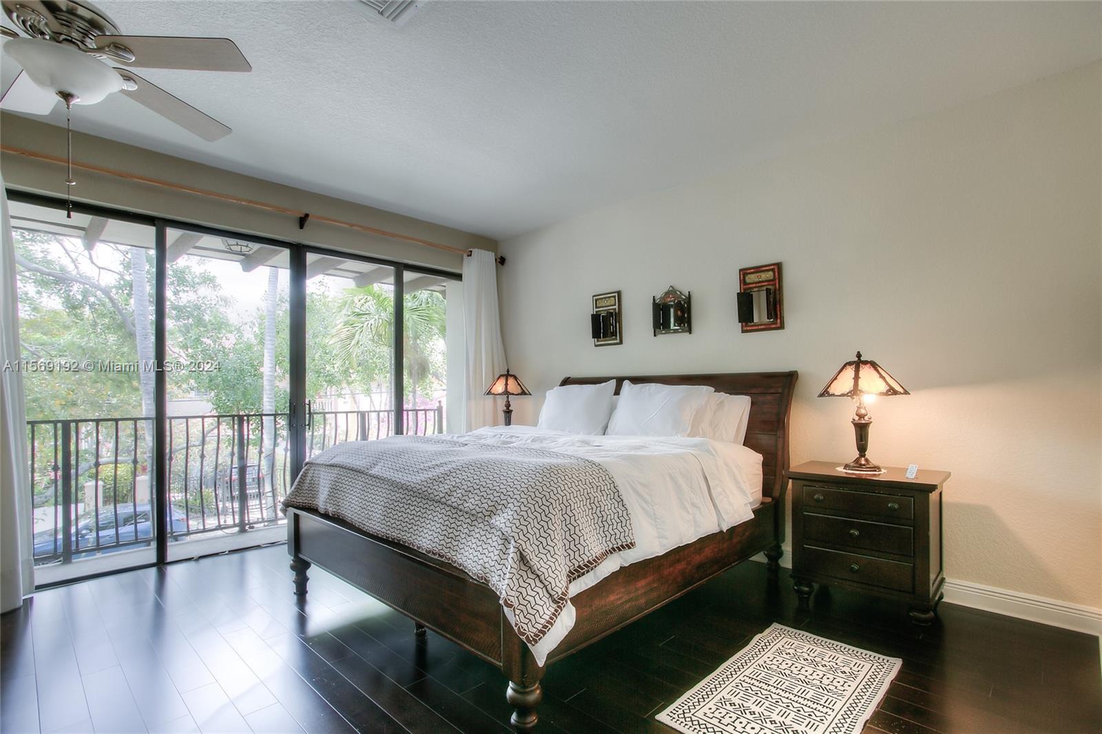 3053 Indiana Street, Unit 12 Miami, FL 33133 - Photo 16 of 23 a large bed sitting in a bedroom next to a window