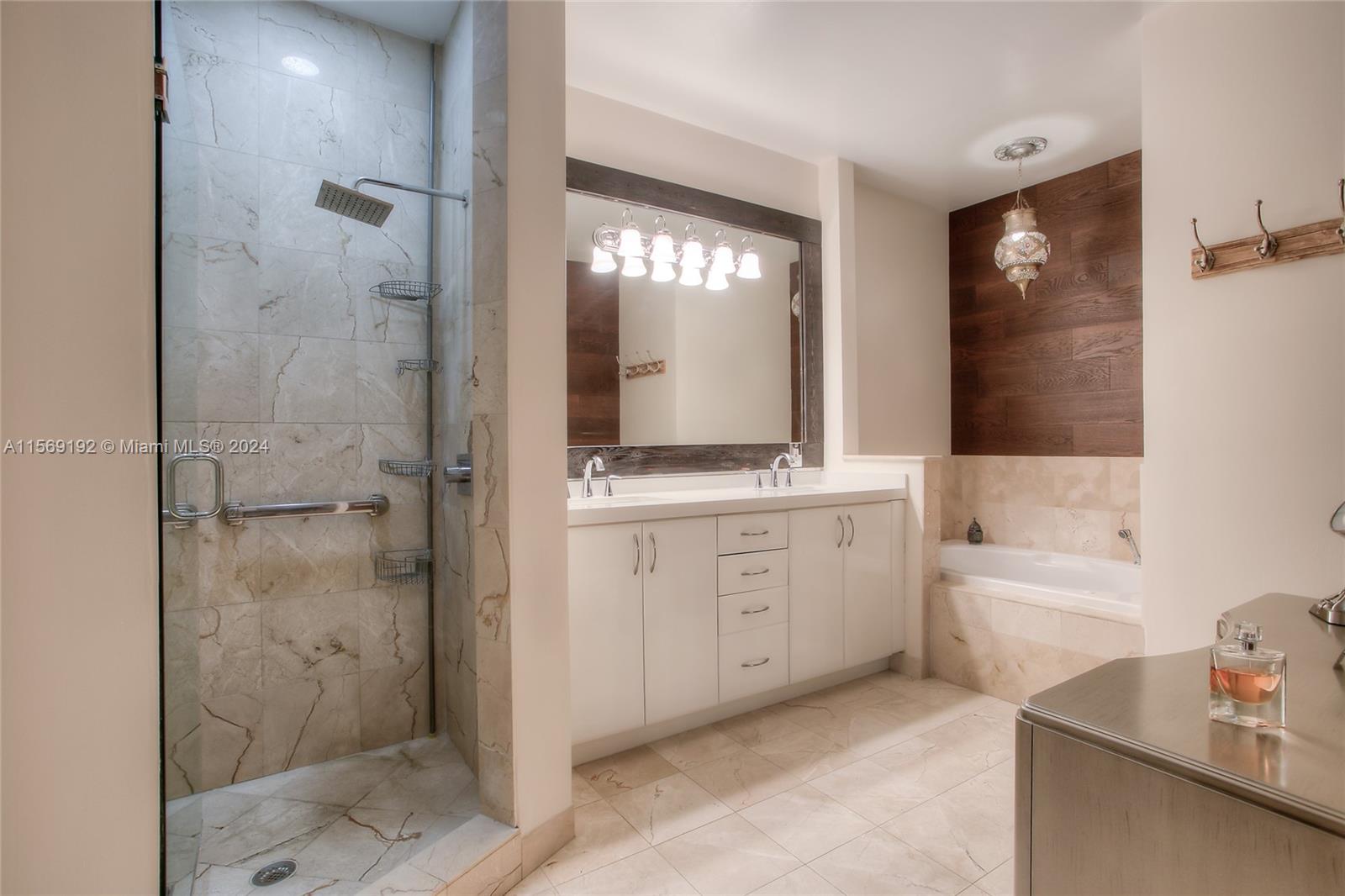 3053 Indiana Street, Unit 12 Miami, FL 33133 - Photo 19 of 23 a bathroom with a double vanity sink toilet and shower