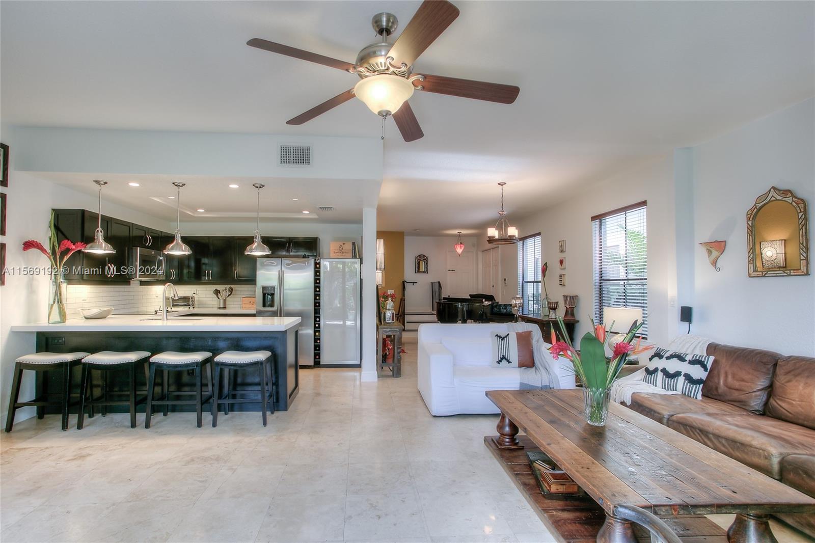 3053 Indiana Street, Unit 12 Miami, FL 33133 - Photo 4 of 23 a living room with furniture a ceiling fan and a window