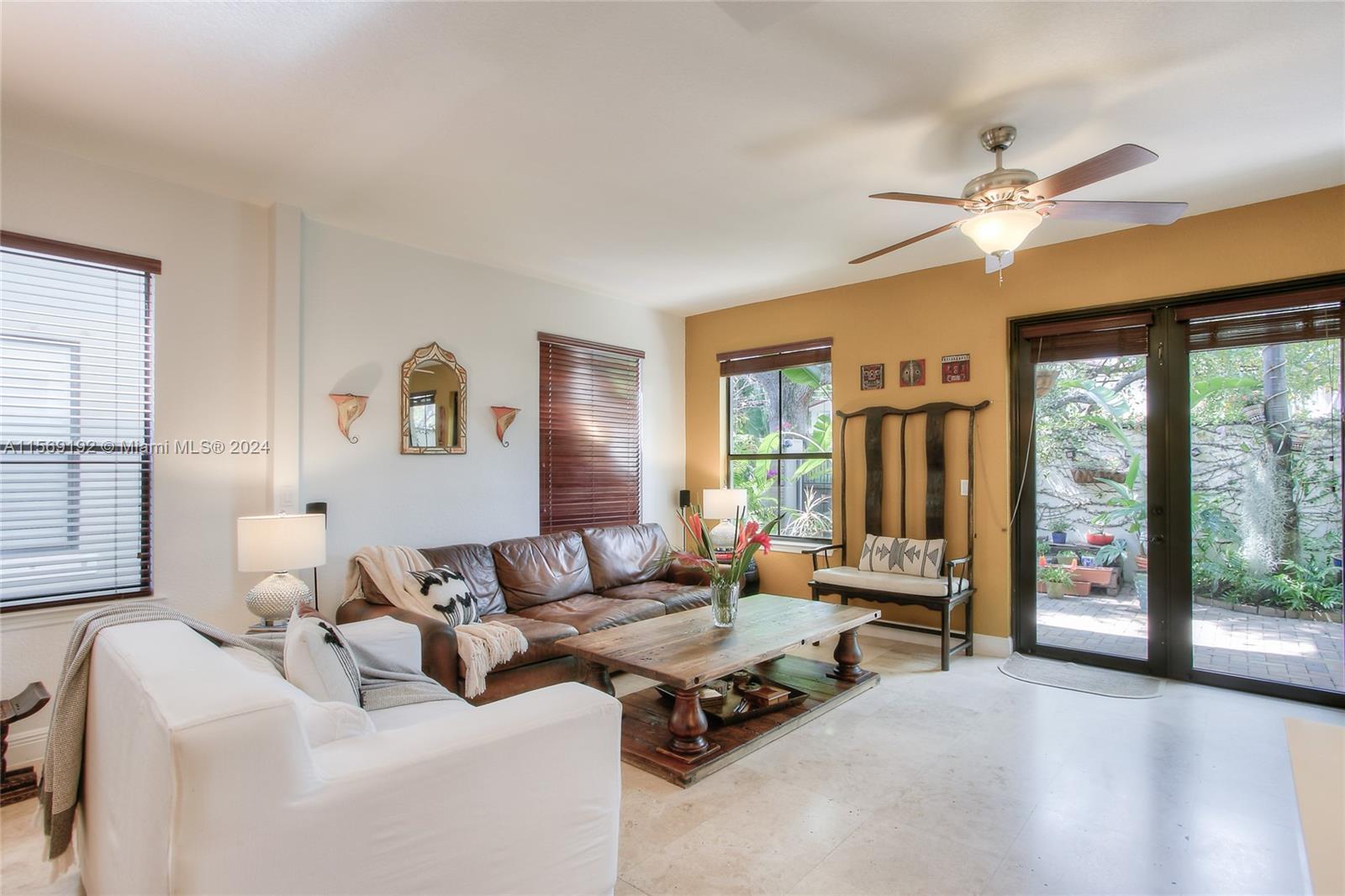 3053 Indiana Street, Unit 12 Miami, FL 33133 - Photo 5 of 23 a living room with furniture and a large window