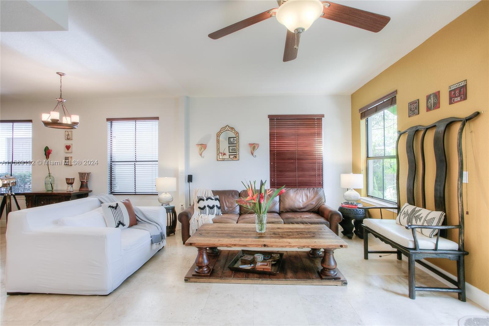 3053 Indiana Street, Unit 12 Miami, FL 33133 - Photo 6 of 23 a living room with furniture and a chandelier