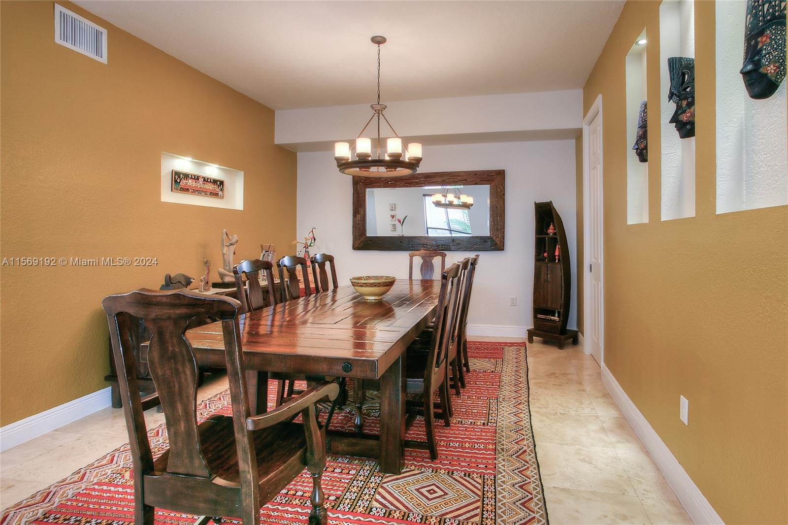 3053 Indiana Street, Unit 12 Miami, FL 33133 - Photo 9 of 23 a view of a dining room with furniture and chandelier