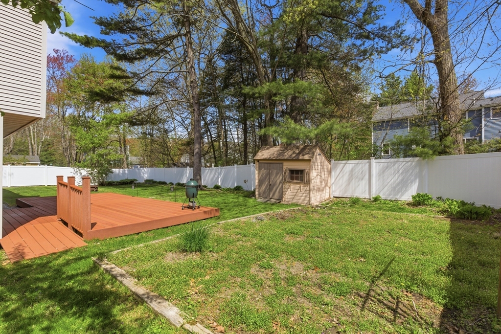 19 Mockingbird Lane Maynard, MA 01754 - Photo 31 of 34 a backyard of a house with table and chairs