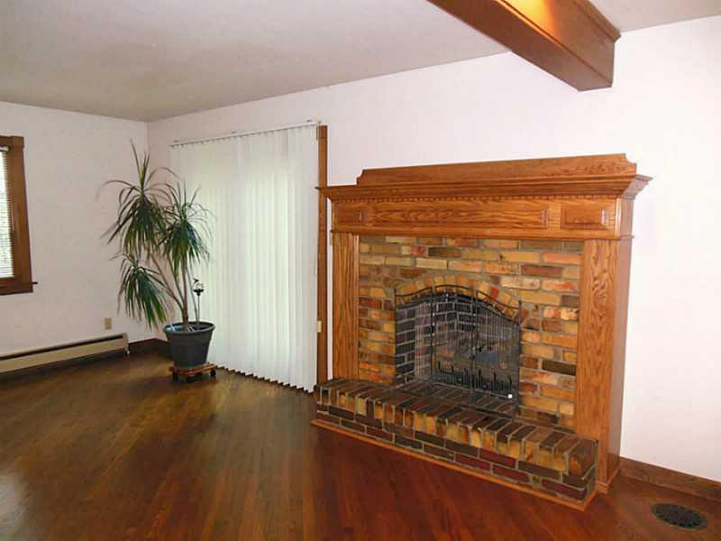 786 Martin Road Indiana, PA 15701 - Photo 3 of 25 Living Room. Gleaming hardwood floors & gorgeous fireplace in a bright living room.