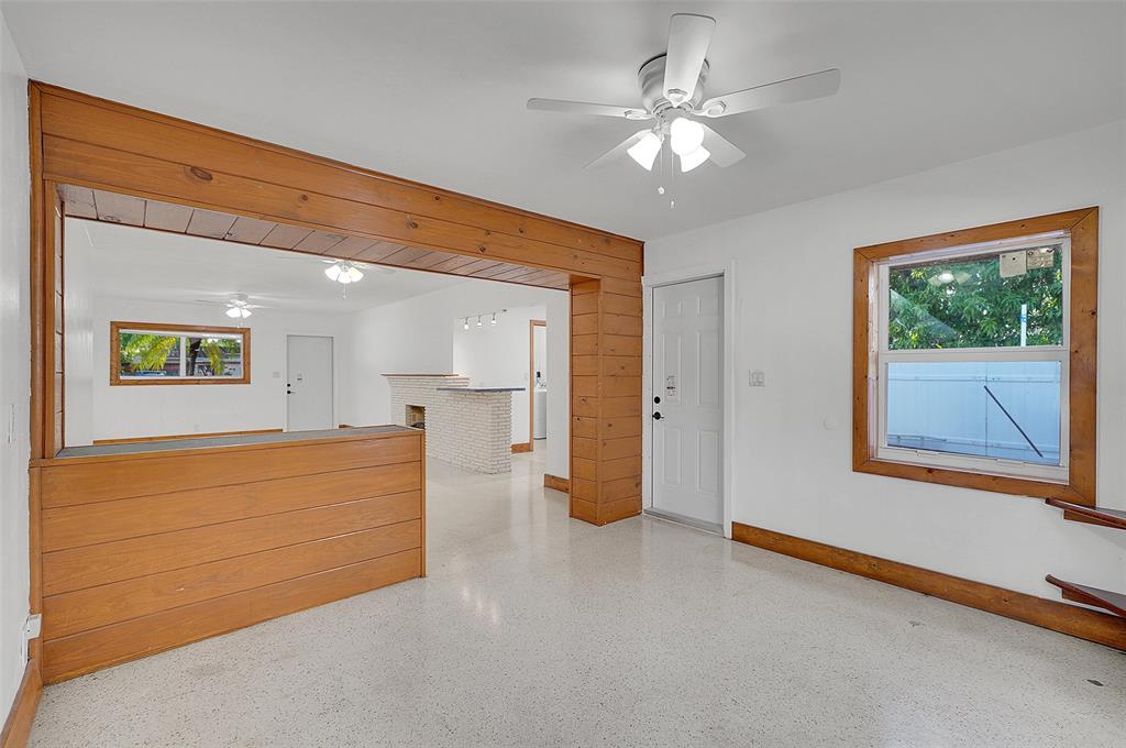 29 Southeast 8th Street Dania Beach, FL 33004 - Photo 20 of 42 a view of an empty room with window and cabinet