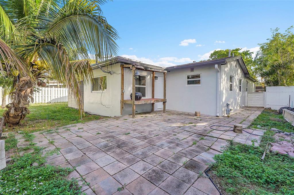 29 Southeast 8th Street Dania Beach, FL 33004 - Photo 39 of 42 a front view of a house with a yard