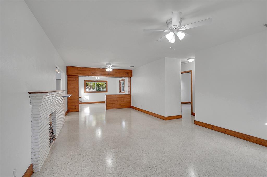 29 Southeast 8th Street Dania Beach, FL 33004 - Photo 8 of 42 a view of an empty room with a fireplace