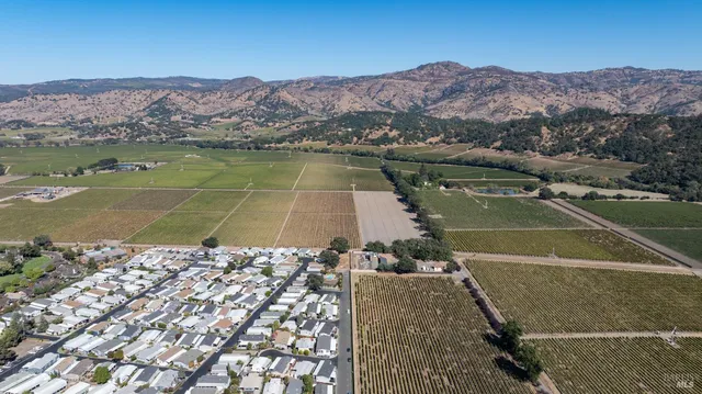 an aerial view of a house with a lake view