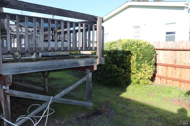 a backyard of a house with a yard and seating space