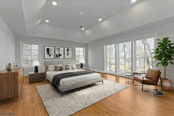 a spacious bedroom with a large bed and a couch