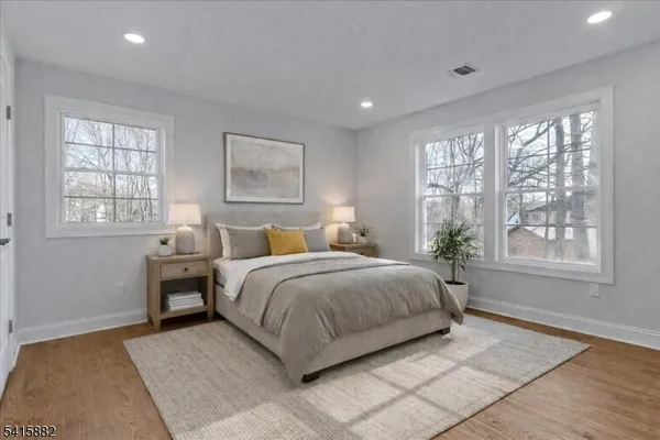 a bedroom with a large bed and a window