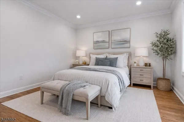 a bedroom with a bed and a chair