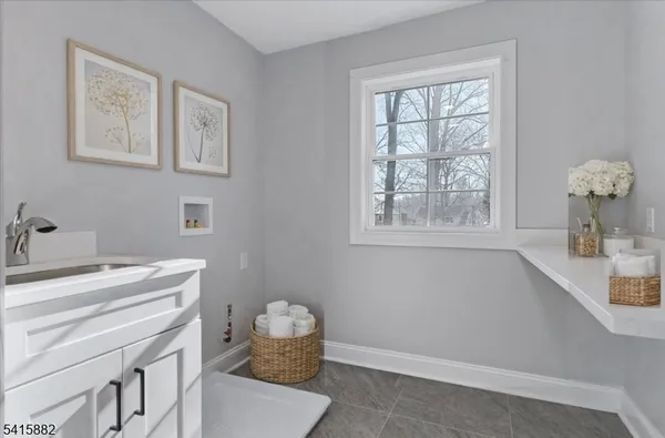 a room with a window and a mirror