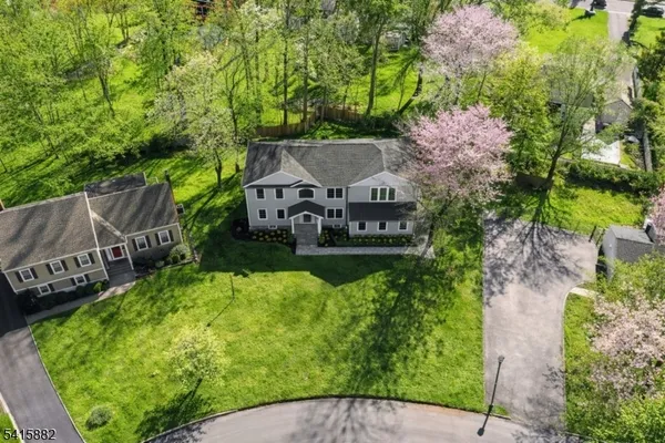 an aerial view of a house with a garden