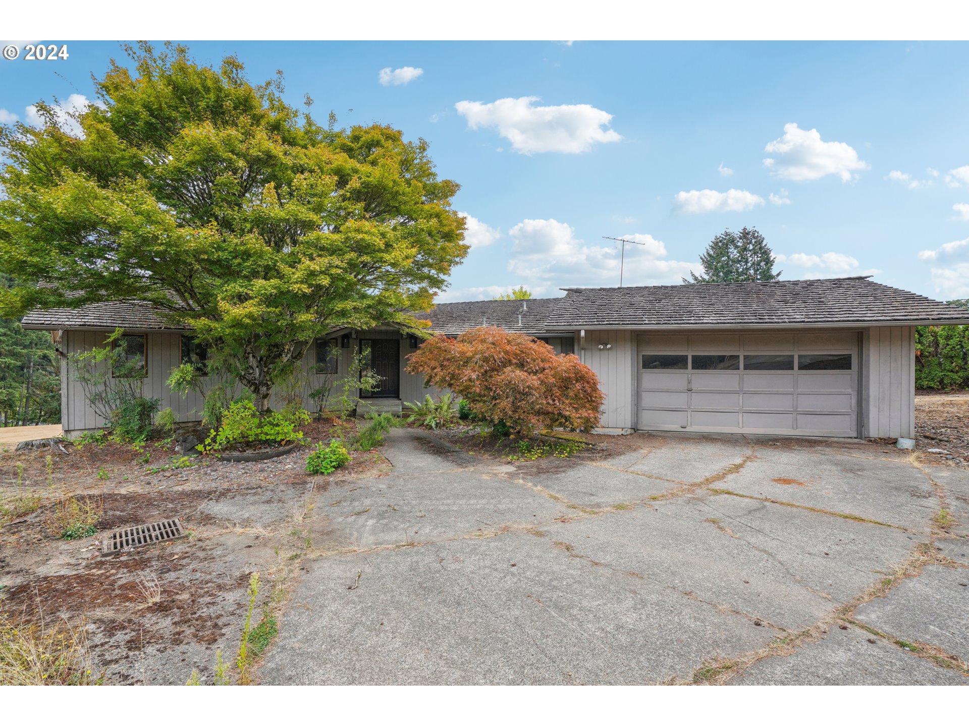12795 Southeast Callahan Road Happy Valley, OR 97086 - Photo 1 of 42 a view of a house with a patio and a yard