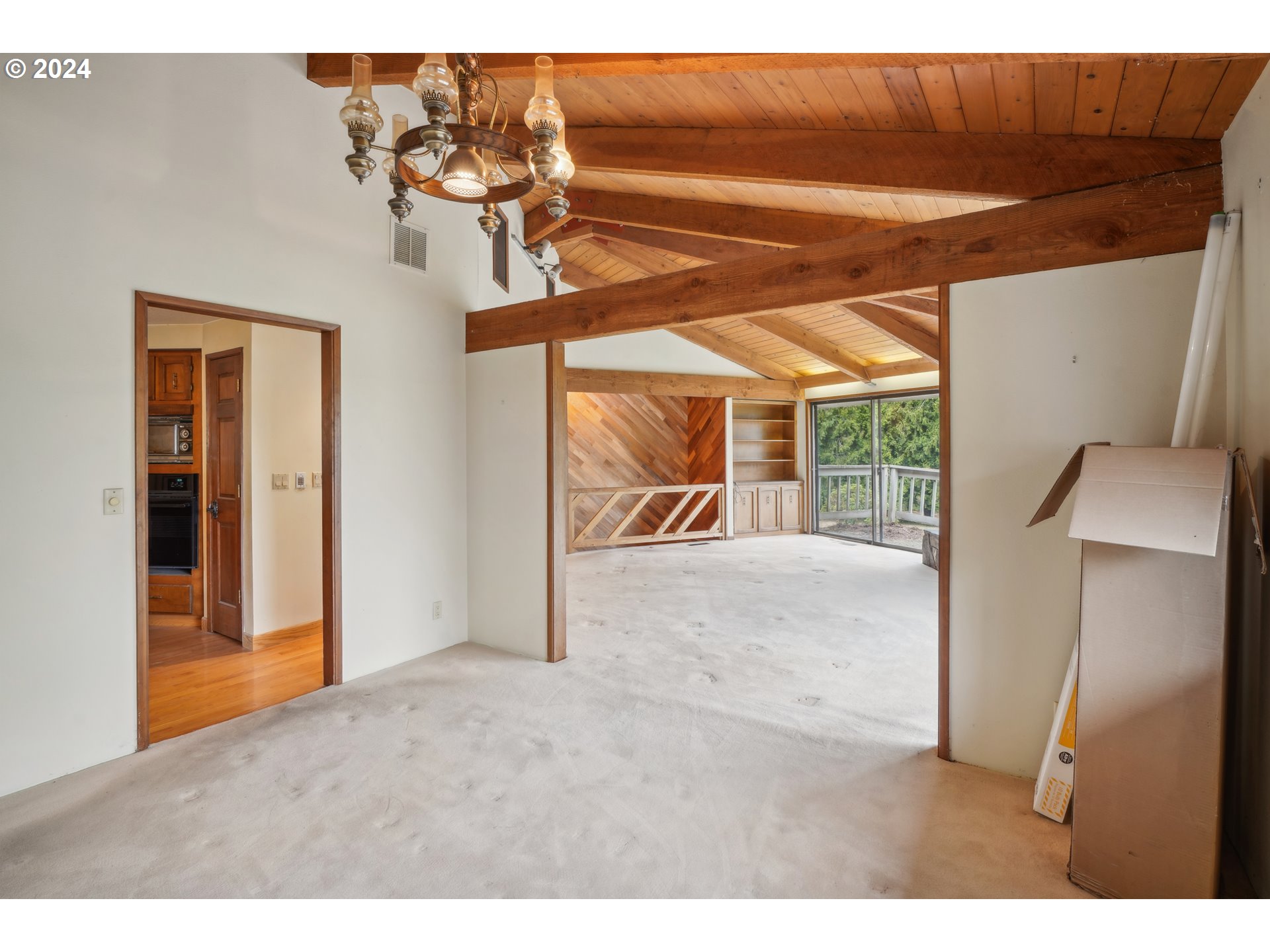 12795 Southeast Callahan Road Happy Valley, OR 97086 - Photo 12 of 42 a view interior of a house wooden floor and a ceiling fan