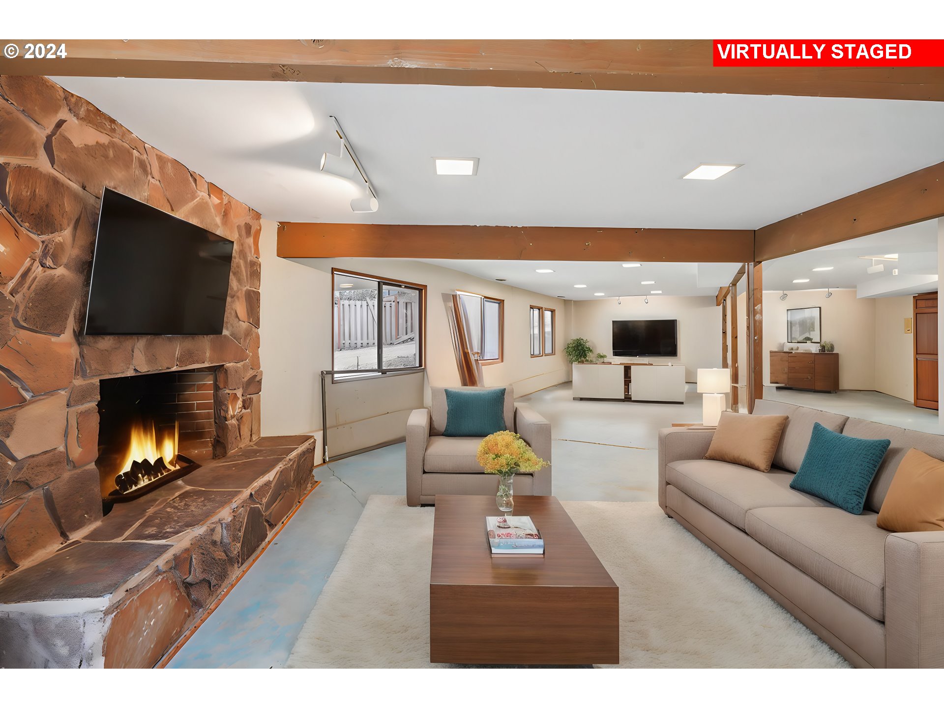 12795 Southeast Callahan Road Happy Valley, OR 97086 - Photo 15 of 42 a living room with furniture a flat screen tv and a fireplace