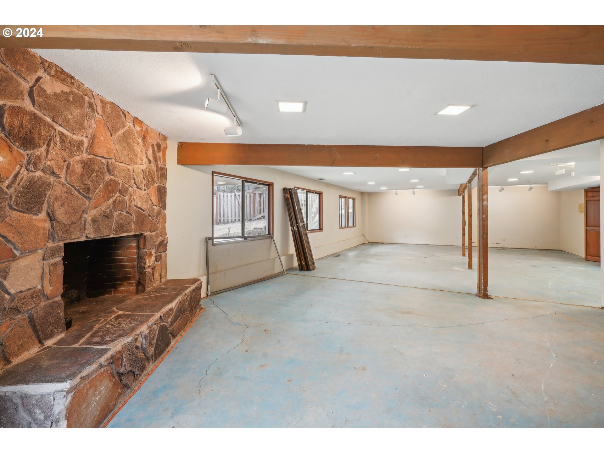 12795 Southeast Callahan Road Happy Valley, OR 97086 - Photo 16 of 42 a view of an empty room with a fireplace