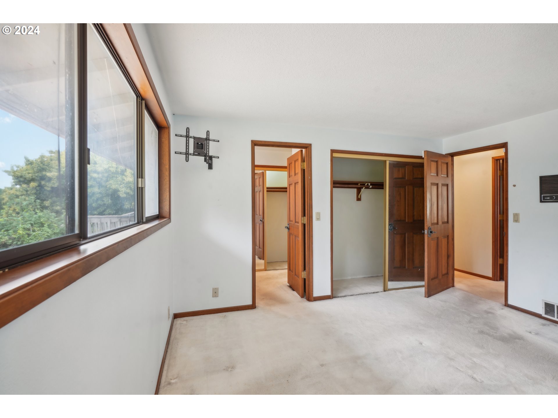 12795 Southeast Callahan Road Happy Valley, OR 97086 - Photo 21 of 42 a view of an empty room with wooden floor and a window
