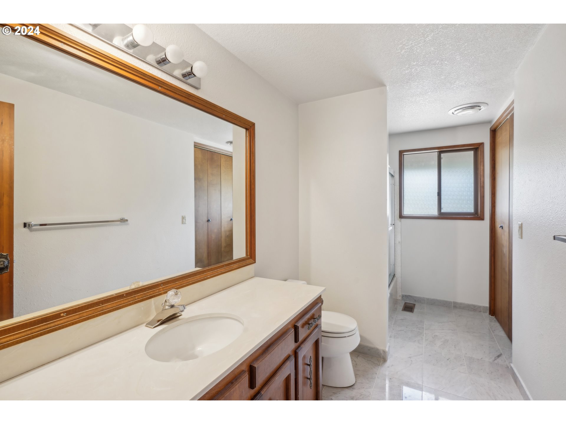 12795 Southeast Callahan Road Happy Valley, OR 97086 - Photo 23 of 42 a bathroom with a granite countertop sink toilet and shower