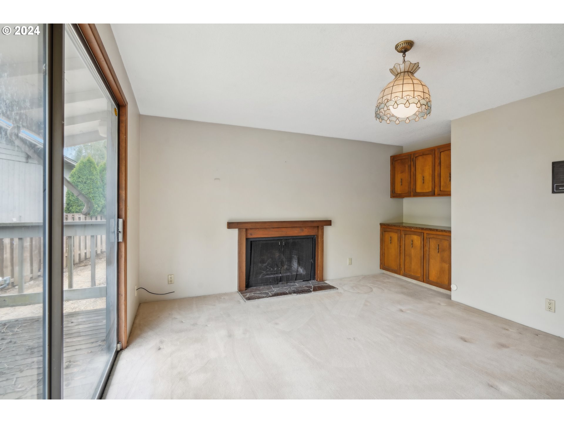 12795 Southeast Callahan Road Happy Valley, OR 97086 - Photo 26 of 42 a view of an empty room with a fireplace