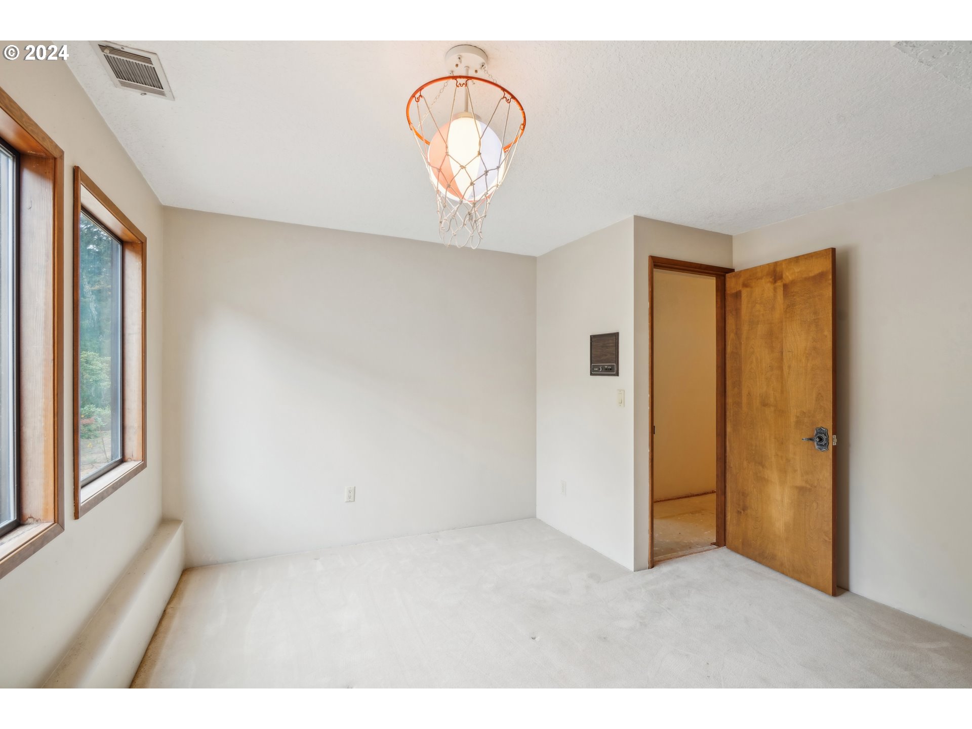 12795 Southeast Callahan Road Happy Valley, OR 97086 - Photo 30 of 42 a view of an empty room with a window