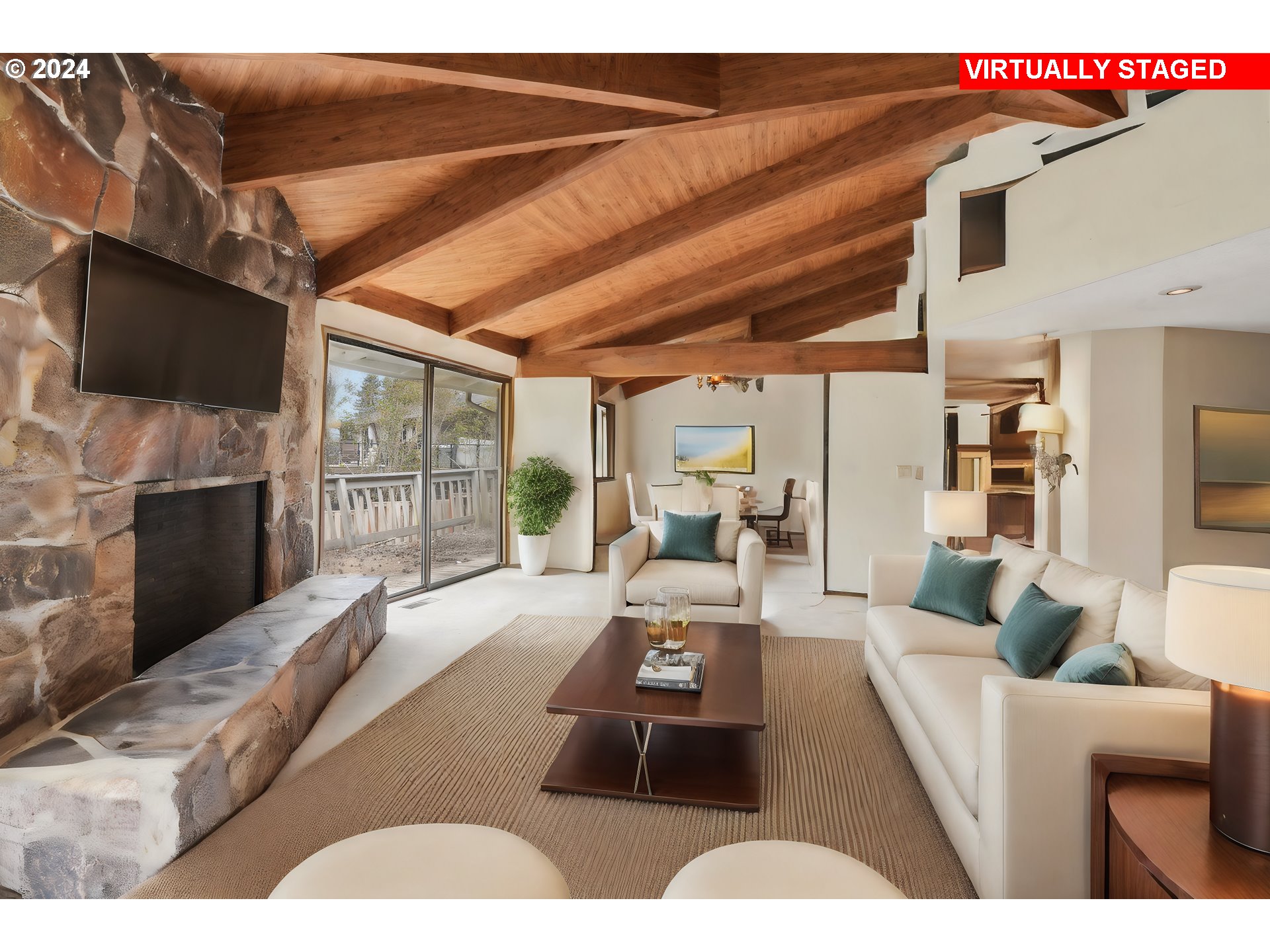 12795 Southeast Callahan Road Happy Valley, OR 97086 - Photo 5 of 42 a living room with furniture a flat screen tv and a floor to ceiling window